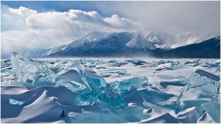 urquoise ice exposed at Lake Baikal in Russia.