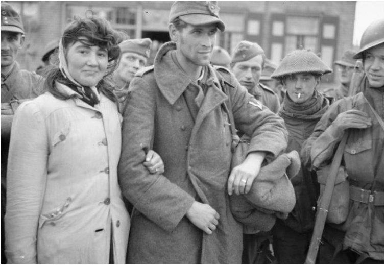 A Dutch woman refuses to leave her husband, a German soldier, after Allied soldiers capture him. She followed him into captivity. [1944]