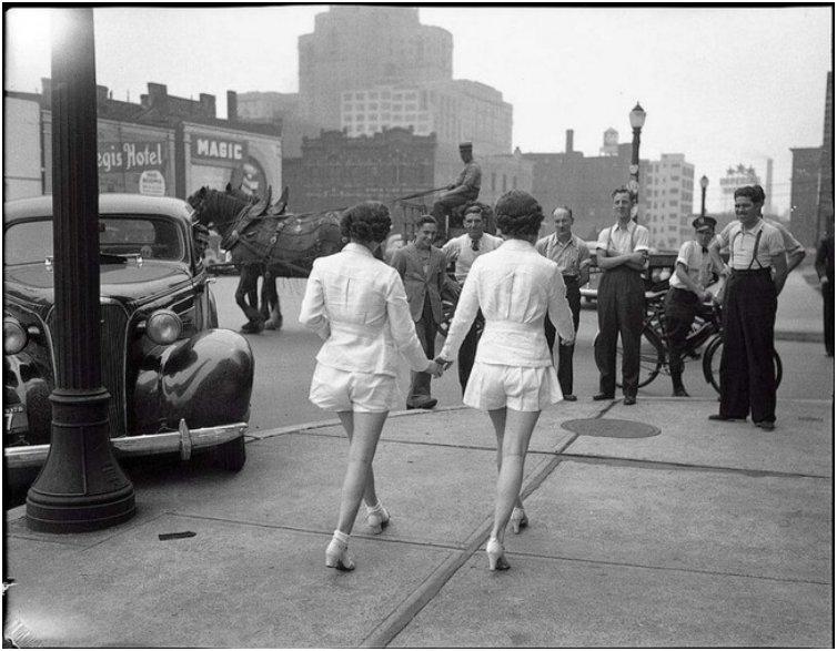 Two women show uncovered legs in public for the first time in Toronto. [1937]