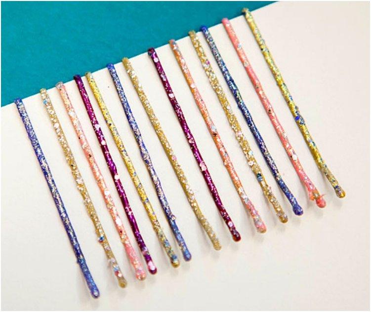 Paint your regular bobby pins a vibrant color or with glitter polish to add some color to your hairstyle