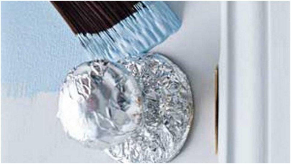 Protect your door handles while painting with aluminum foil