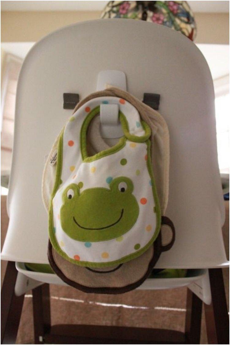 Use a command hook behind your high chair to hang bibs.