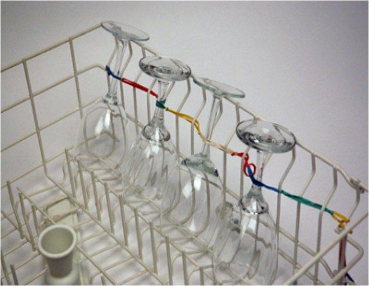 Keep your wine glasses secured in the dishwasher with rubber bands