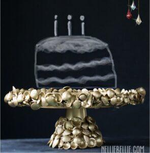 golden shell encrusted cake stand