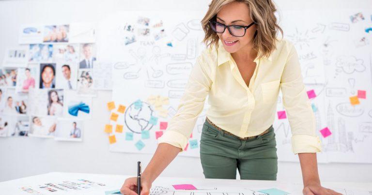 Woman drawing a business plan
