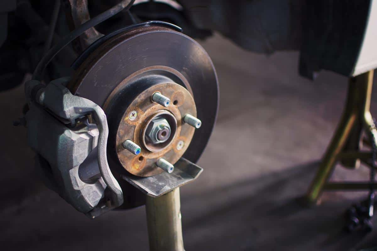 Car brake disc without wheels closeup with repair.