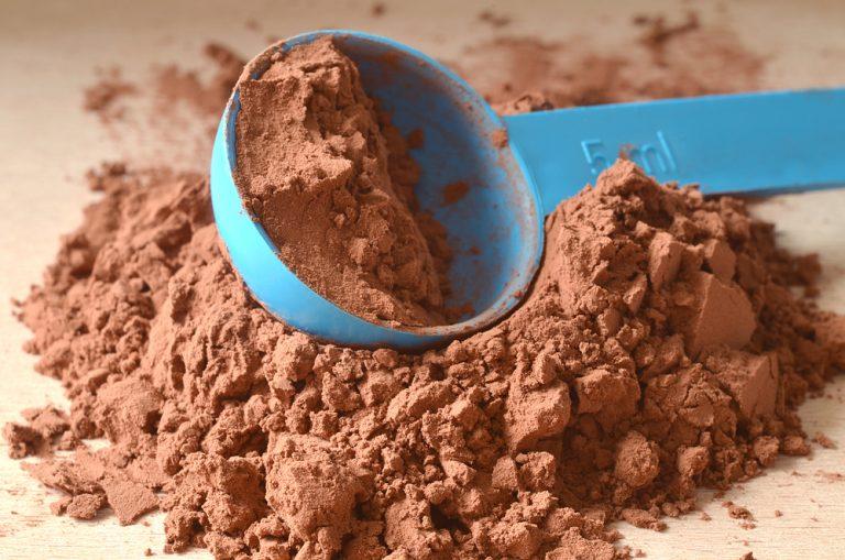 Scoop in brown powder
